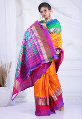 Cross Amber Orange with Ganga-Jamuna Border (Green and Rani Pink) Handloom Pure Ikkat Saree With Blouse Piece - Adi Akshoy & Co.